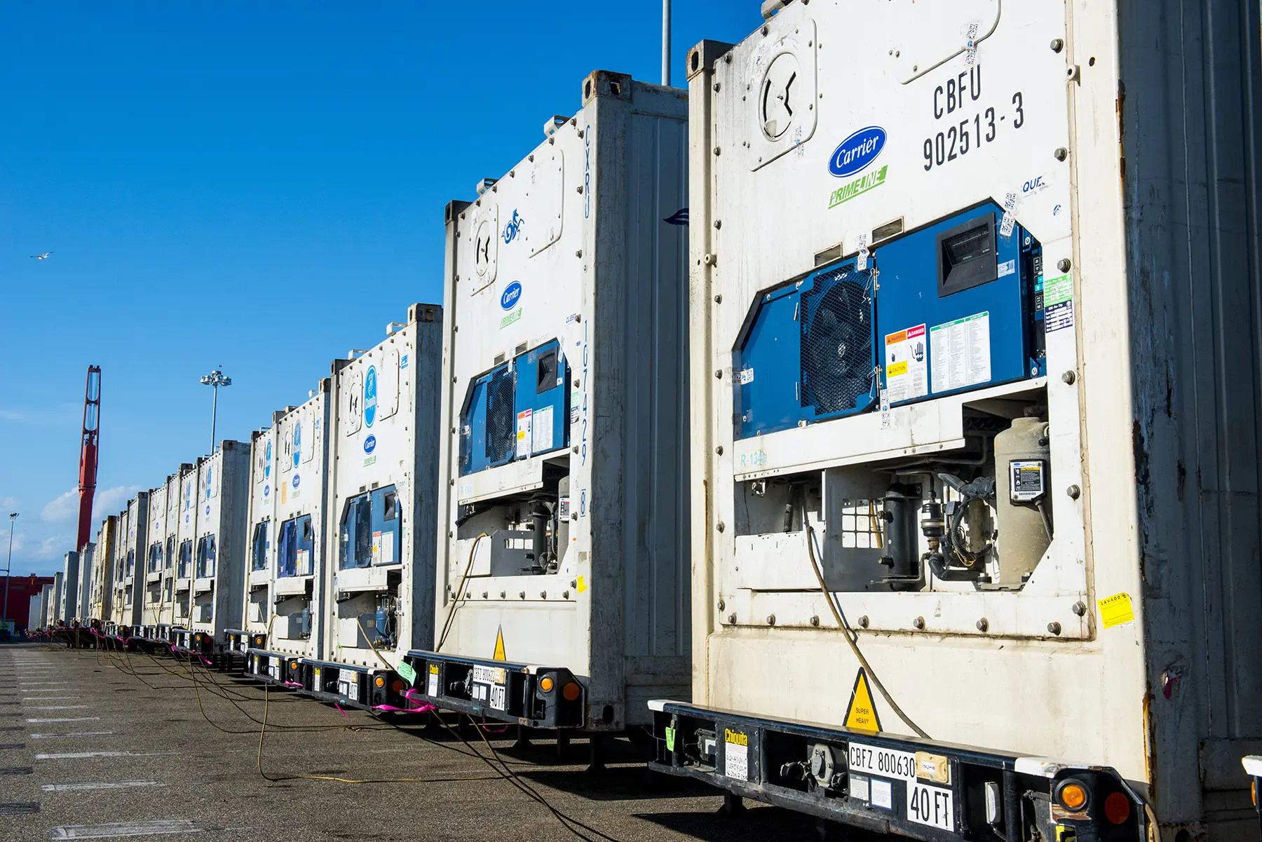 Line of cargo containers showing the air conditioning units.