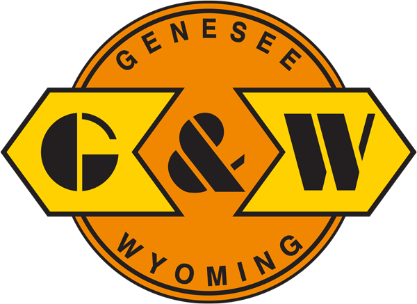 Genesee & Wyoming logo featuring large yellow and black "G&W" letters inside an orange circle with yellow hexagonal outlines, reminiscent of vintage automobile emblems.