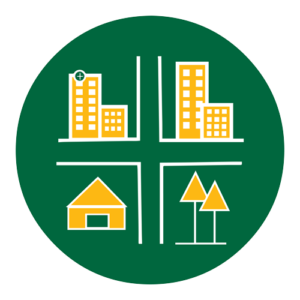 A green circular icon featuring a modernized hospital, apartment buildings, a house, and trees, each occupying a quadrant divided by white lines resembling streets.